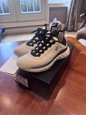 CHANEL women’s white and Black Runner Sneakers